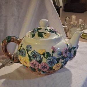 Ceramic teapot with hand-painted floral design by Flowers, Inc. Balloons